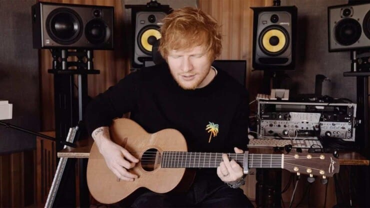 ed sheeran playing guitar while singing