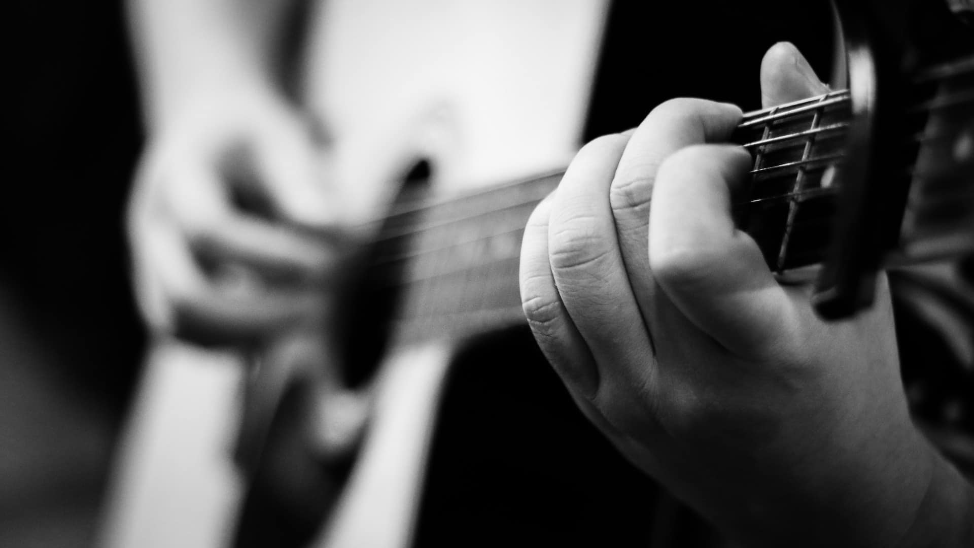 playing guitar with small hands - playing acoustic guitar