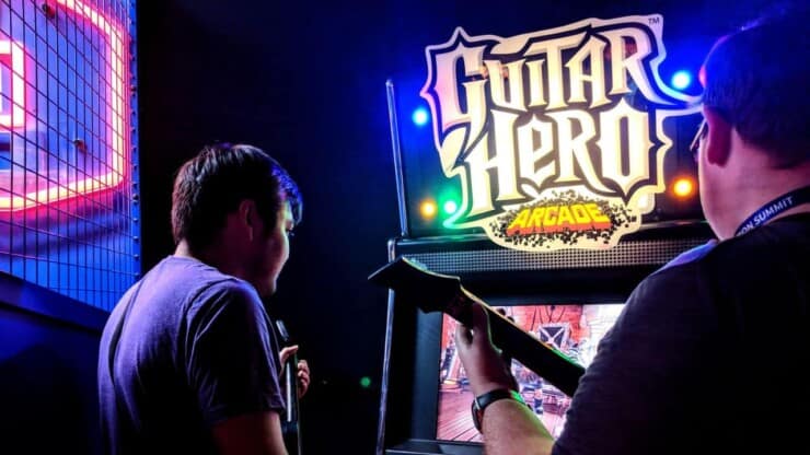 two guitarists playing guitar hero